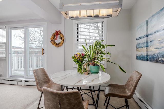 dining area featuring a baseboard radiator and carpet flooring