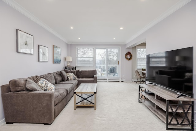 carpeted living room with a baseboard heating unit, crown molding, and a wealth of natural light