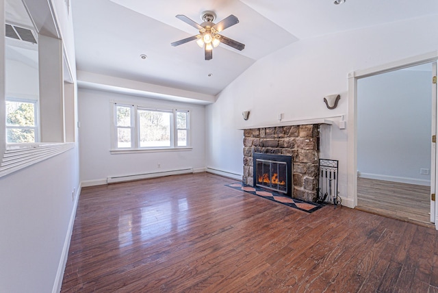 6 Mcgill Rd, Monroe, NY 10950 - unfurnished living room with baseboard heating, dark hardwood / wood-style floors, a stone fireplace, and vaulted ceiling