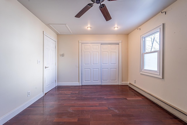 6 Mcgill Rd, Monroe, NY 10950 - unfurnished bedroom featuring ceiling fan, a baseboard heating unit, dark hardwood / wood-style floors, and a closet