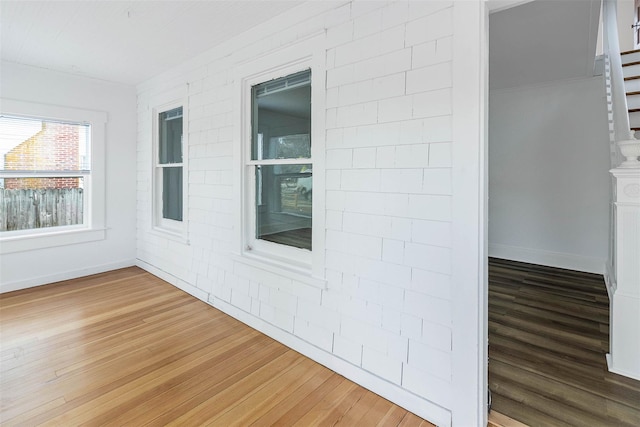 empty room with hardwood / wood-style floors