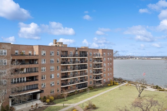 view of building exterior with a water view