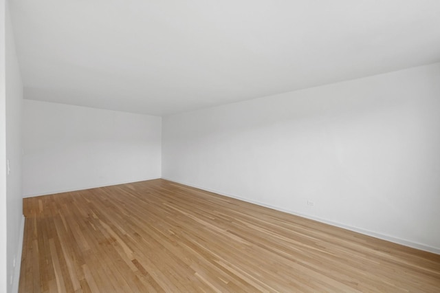 spare room with light wood-style floors