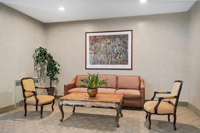 living area with baseboards and recessed lighting