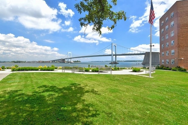 exterior space with a water view and a yard