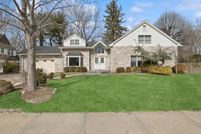 view of front of property featuring an attached garage, stone siding, and a front lawn