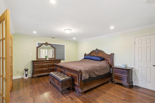 bedroom featuring dark wood-style floors, recessed lighting, and baseboards