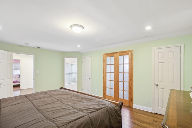 bedroom featuring recessed lighting, multiple windows, baseboards, and wood finished floors