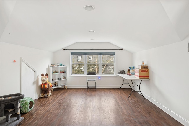 interior space featuring lofted ceiling, baseboards, and dark wood-type flooring