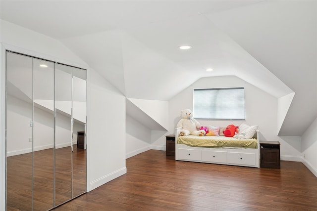 additional living space featuring vaulted ceiling, dark wood-style flooring, recessed lighting, and baseboards