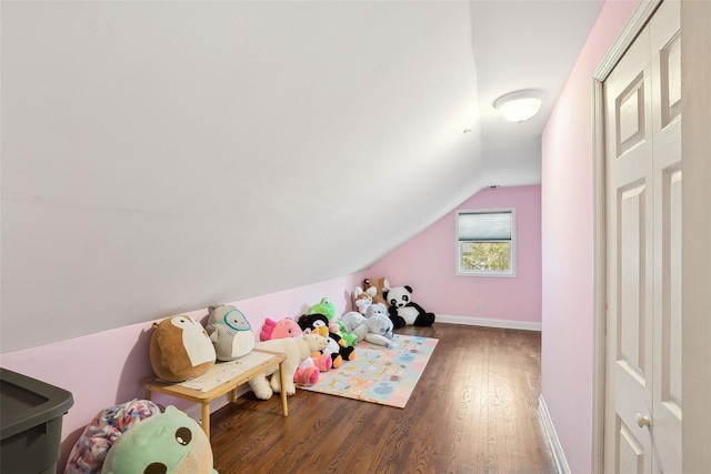 game room with lofted ceiling, baseboards, and wood finished floors