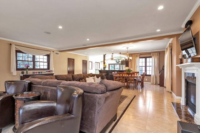 living area with ornamental molding, recessed lighting, baseboards, and a premium fireplace