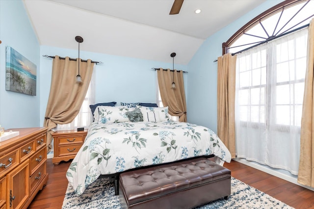 bedroom featuring a ceiling fan, vaulted ceiling, and dark wood-type flooring