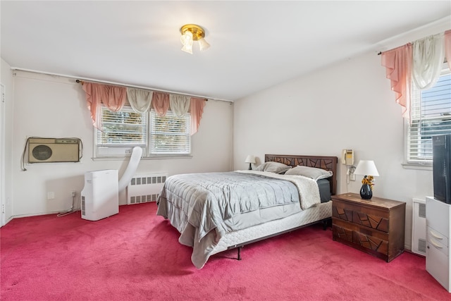 bedroom featuring radiator heating unit and carpet flooring