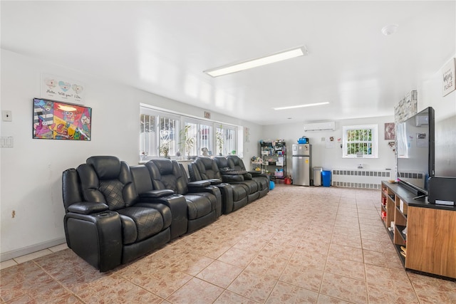 cinema room featuring radiator, light tile patterned floors, and a wall mounted AC