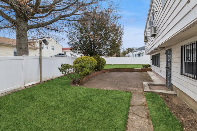 view of yard with a fenced backyard and a patio