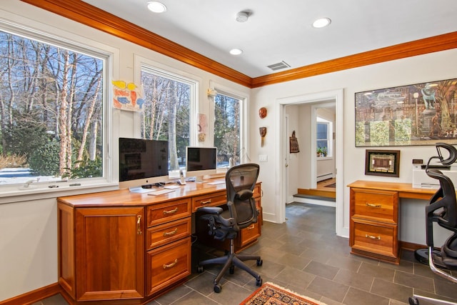 office area with ornamental molding and built in desk