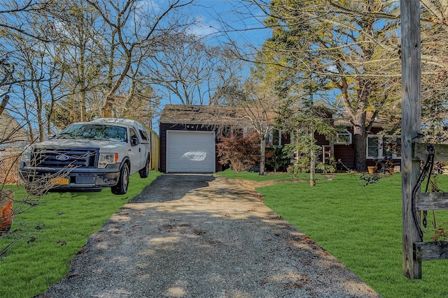 view of front of property with a garage and a front yard