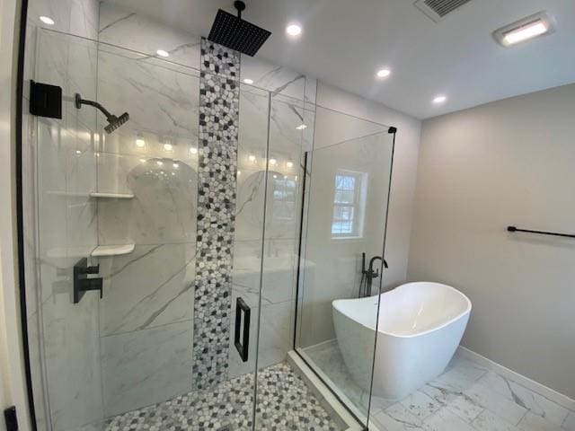 bathroom featuring separate shower and tub