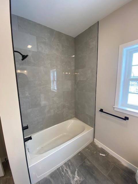 bathroom with tiled shower / bath combo