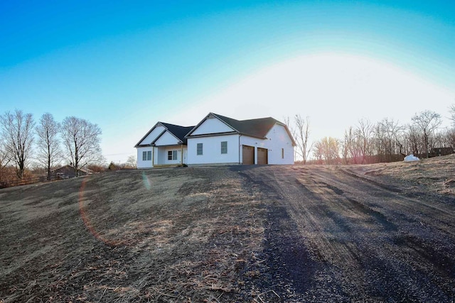 view of front of house featuring driveway and a garage