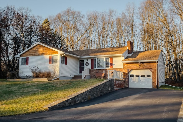 ranch-style home featuring driveway, an attached garage, a chimney, and a front lawn