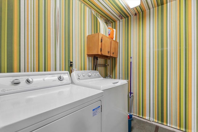 laundry area featuring wallpapered walls, laundry area, and washer and dryer