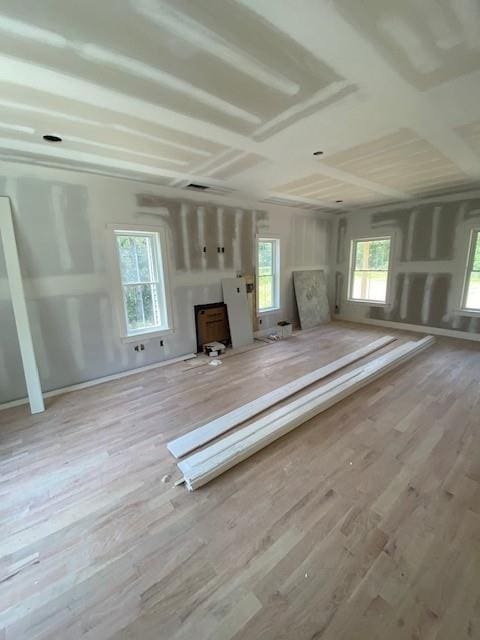 89 Leslie Rd, Newburgh, NY 12550 - unfurnished living room featuring wood finished floors and a wood stove