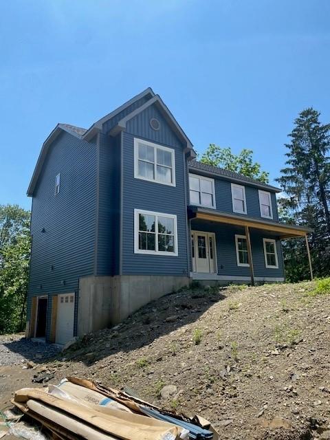 89 Leslie Rd, Newburgh, NY 12550 - rear view of house with covered porch and an attached garage