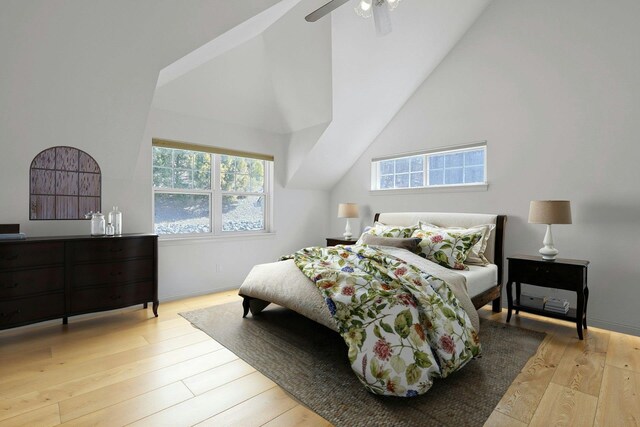 bedroom featuring wood-type flooring, vaulted ceiling, and a ceiling fan