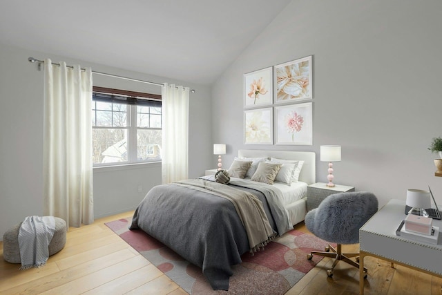 bedroom featuring wood-type flooring and vaulted ceiling