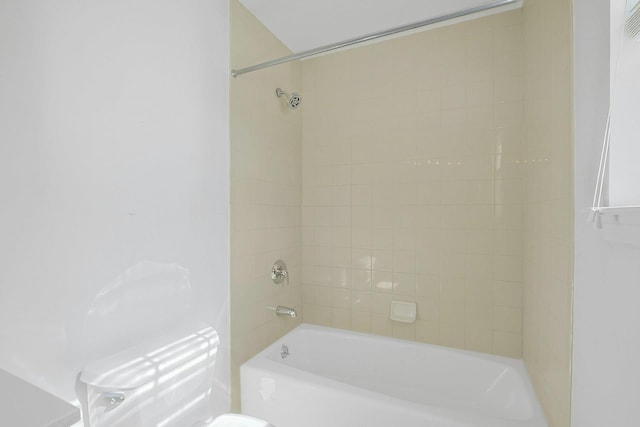 bathroom with toilet and washtub / shower combination