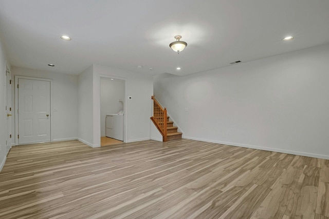 empty room with recessed lighting, visible vents, washer and dryer, stairway, and light wood-type flooring