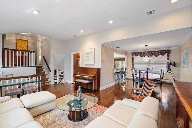 living room featuring crown molding, visible vents, stairway, wood finished floors, and baseboards