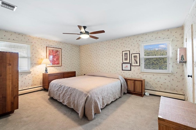 carpeted bedroom with a baseboard heating unit, baseboard heating, visible vents, and wallpapered walls