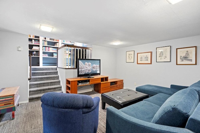 carpeted living room featuring a textured ceiling, baseboards, and stairs