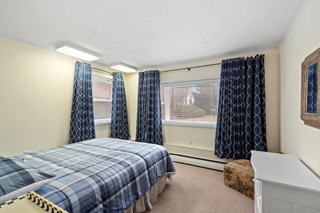 bedroom featuring carpet floors, baseboard heating, and crown molding