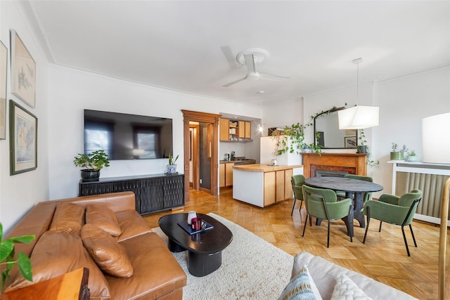 living room with ceiling fan and light parquet floors