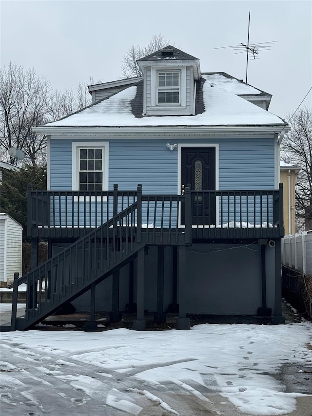 bungalow-style home with a deck