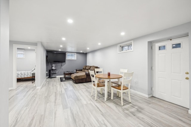 dining room featuring light wood-style floors, baseboards, and recessed lighting