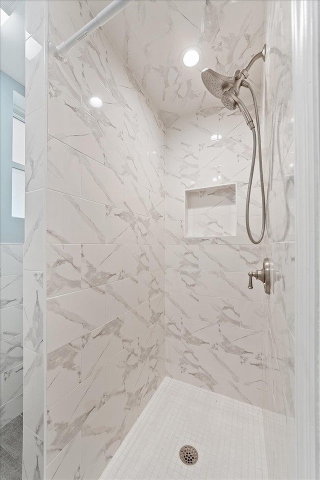 bathroom with tiled shower