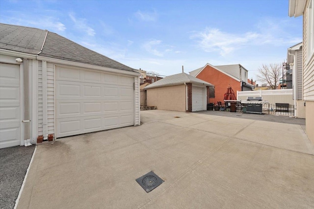 garage with fence