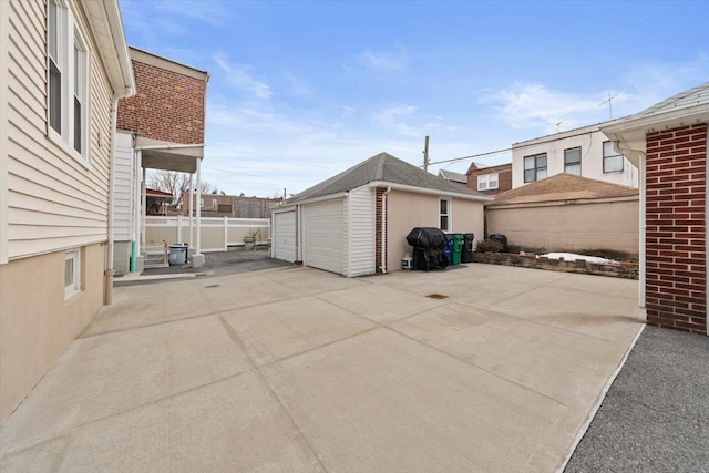 view of patio with fence and an outdoor structure