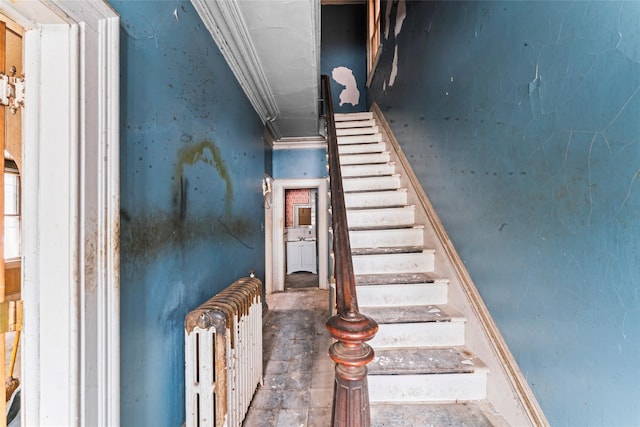 staircase featuring radiator heating unit