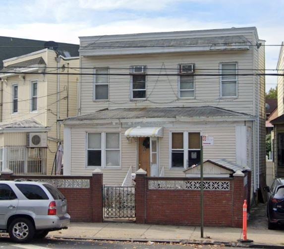 view of property featuring a fenced front yard