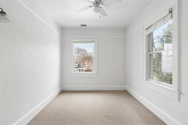 carpeted empty room with ceiling fan