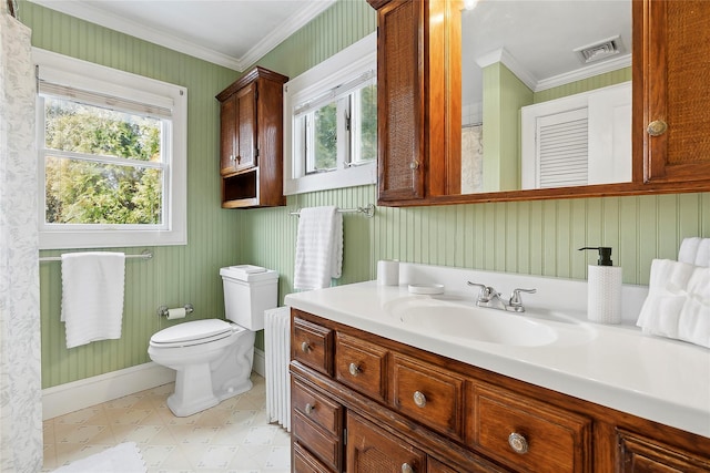 bathroom with toilet, crown molding, and vanity