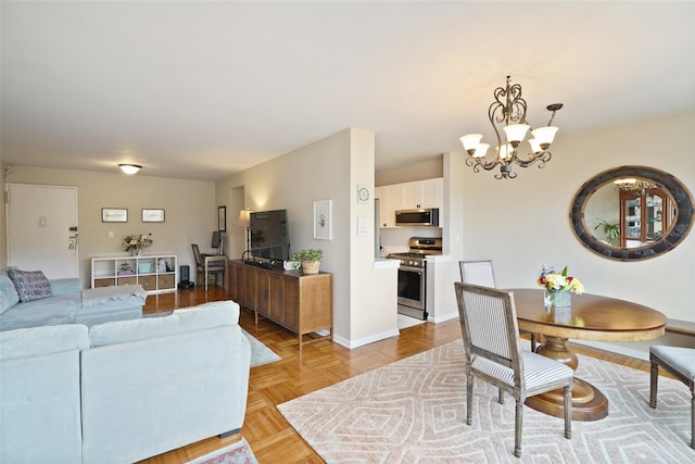 dining room with baseboards and an inviting chandelier