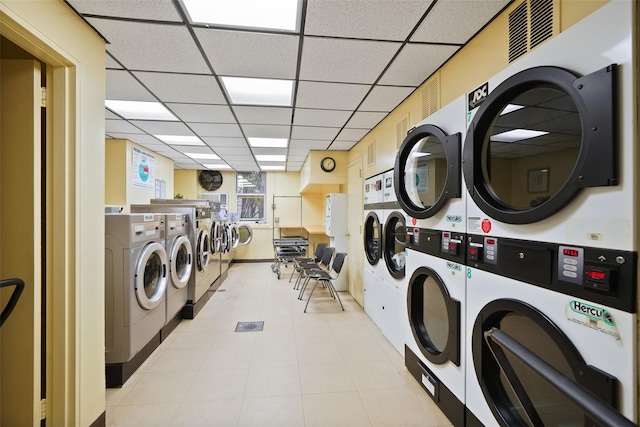 common laundry area featuring stacked washer / dryer, visible vents, and separate washer and dryer