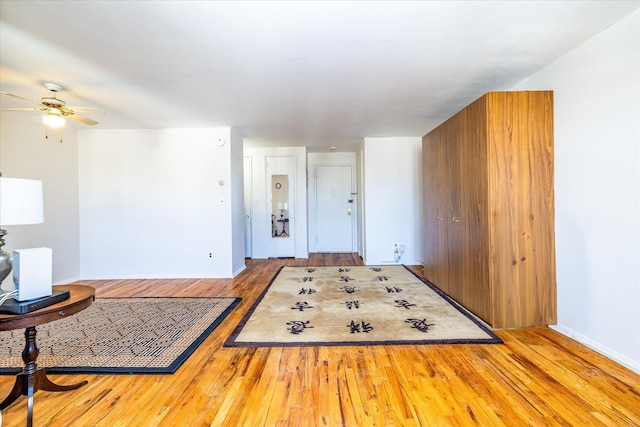 interior space featuring light wood-style floors and a ceiling fan